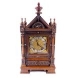 A Victorian oak cased mantel clock, square brass dial with gilt floral spandrels, silvered chapter