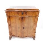 A Victorian serpentine flame mahogany side cabinet, in the French taste, with single frieze drawer