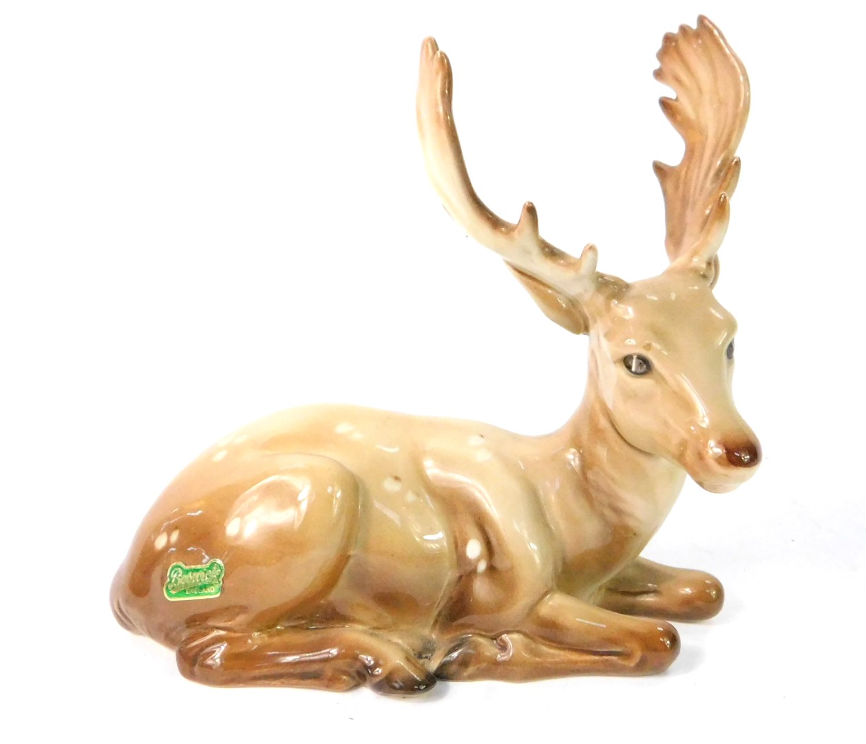 A Beswick figure of a stag deer, modelled in recumbent pose, No 954, printed and impressed marks.