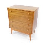 An Alfred Cox Handcraft Quality walnut chest of drawers, with four long drawers raised on tapering