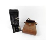 A Houghtons Limited Ensign camera, black cased, with a Kodak tan leather outer case.