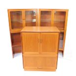 A G-Plan late 20thC teak cabinet, with two glazed doors opening to reveal a single glass shelf,