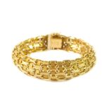 An 18ct gold bracelet, of interwoven Gothic design, on a snap clasp, 50g.