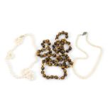 A string of cultured pearls, on a 9ct gold ball shaped snap clasp, further string of graduated