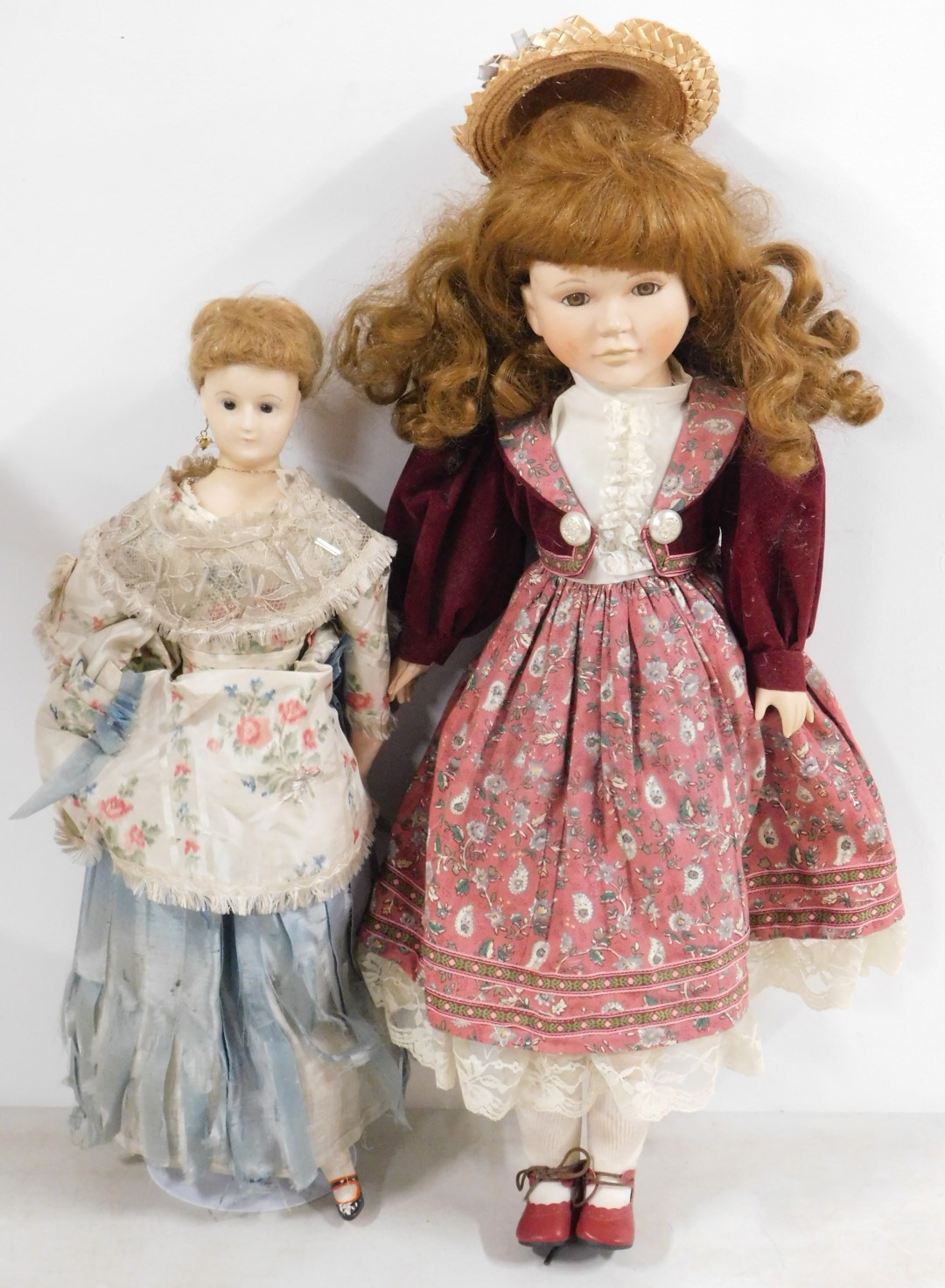 A Victorian style doll, with a vulcanised rubber head, composite and wooden body and costume with