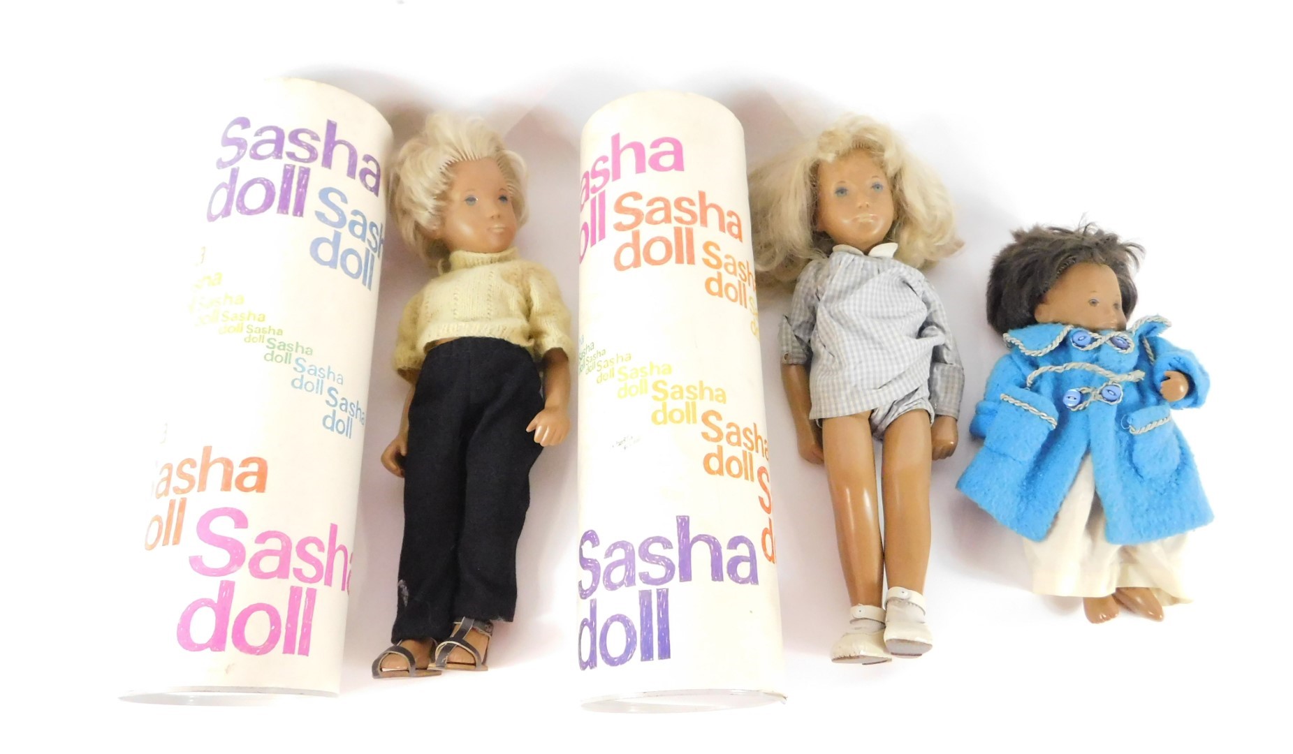 Two Sasha dolls, with blonde hair, and clothes, boxed, together with a Sasha baby doll, clothed. (