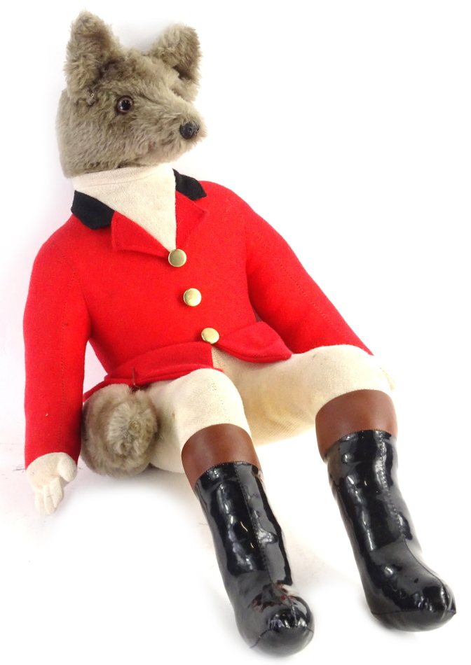 A toy model of a seated fox, wearing hunting outfit with PVC boots, etc