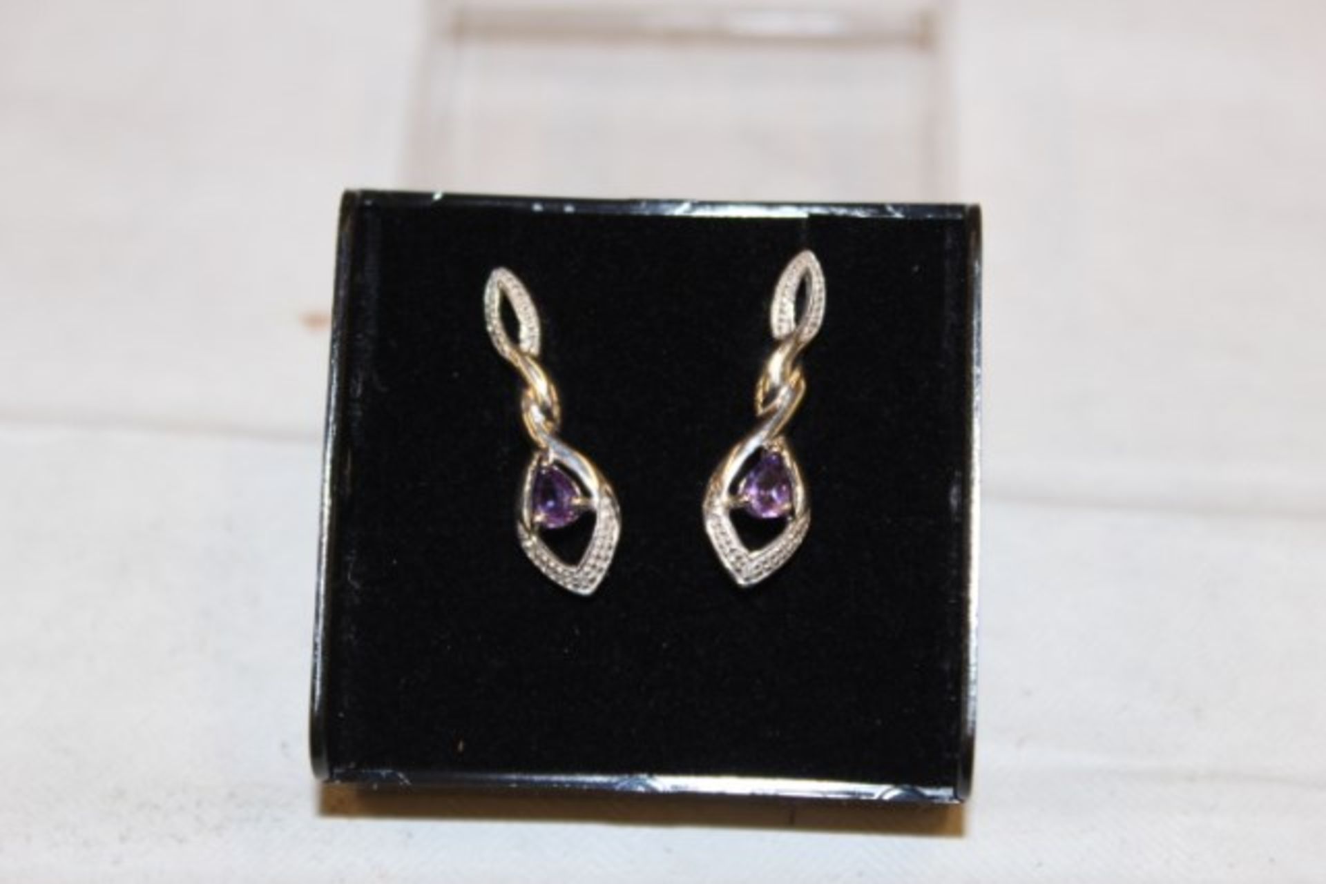 Grade U Pair Of Purple Topaz Earrings