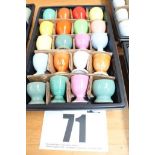 TRAY & CONTENTS OF 20 COLOURED PEDESTAL EGG CUPS.