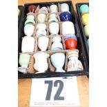 TRAY & CONTENTS OF 20 COLOURED PEDESTAL EGG CUPS.