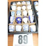 TRAY & CONTENTS OF 20 BLUE & WHITE TUB & PEDESTAL EGG CUPS.