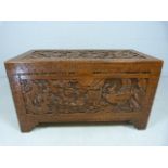 Heavily carved hardwood trunk