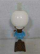 Cast Iron base oil lamp with blue font and twin burner