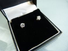 Pair of 18ct white gold diamond stud earrings of 1.1cts