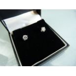 Pair of 18ct white gold diamond stud earrings of 1.1cts