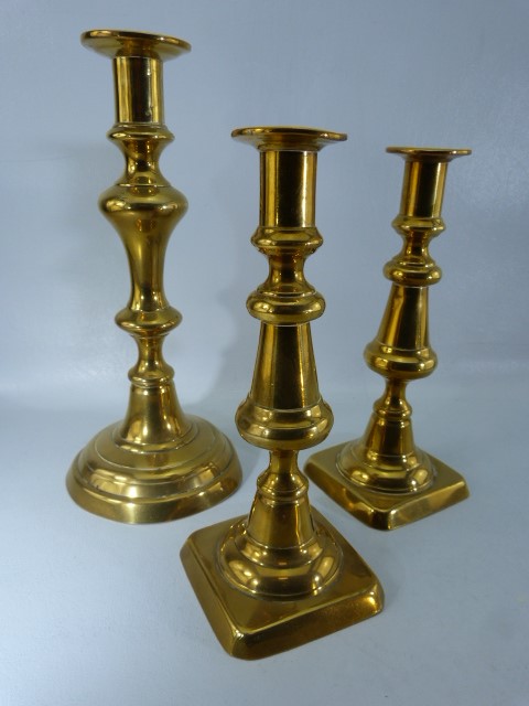 Antique brassware to include a brass and copper sive with turned wooden handle, three candlesticks - Image 3 of 7