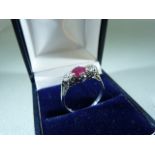 18ct white gold three stone ruby and diamond ring of approx 1.1cts