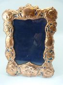 Large copper and enamel-set Art Nouveau style easel back picture frame