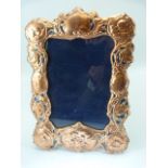 Large copper and enamel-set Art Nouveau style easel back picture frame