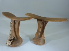 African Headrest with attached leather straps to both. Each simply carved.