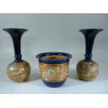 Royal Doulton Vase and two bud Vases in the Lambeth style with enamel painting