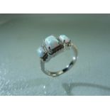 Silver (S925) ring with CZ and three opals