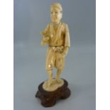 Meji period Japanese ivory figure of a scholar on wooden stand