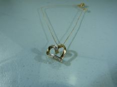 9ct Gold heart shaped pendant on chain.