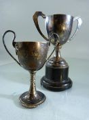 Two Hallmarked Silver Trophies, one on ebonised plinth. (Total weight of silver without the plinth