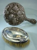 Silver backed brush and a dressing mirror A/F