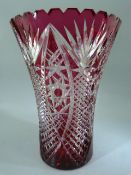 Bohemian crystal cranberry flash overlay glass vase with star cut base.