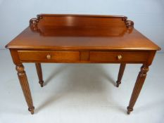 Mahogany serving table with two drawers and galleried back. Reeded pilaster style legs. Retailed