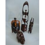 Four carved african masks/ panels