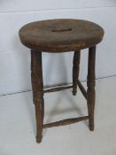 Antique milking stool with handle