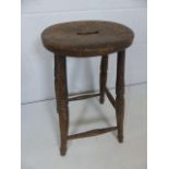 Antique milking stool with handle