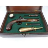 Cased Percussion Cap Officers Pistol complete with Powder Flask, Powder measure, circular Wooden cap