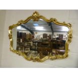 Large shaped gold frame mirror