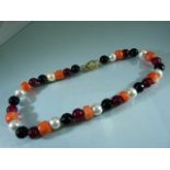 Necklace set with corals, pearls, onyx and rubilite