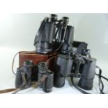 Pair of vintage binoculars and two other pairs
