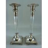 Heavily plated continental candlesticks with glass middles.