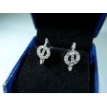 Pair of 18ct white gold diamond earrings in the form of musical notes