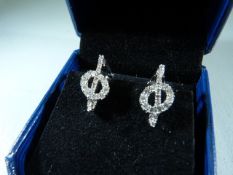 Pair of 18ct white gold diamond earrings in the form of musical notes