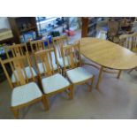 Ercol Saville Extending table and 6 Upholstered Ercol dining chairs - Light elm.