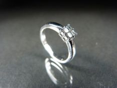 18ct White Gold Diamond cluster ring comprising Four diamonds of approx 30pts