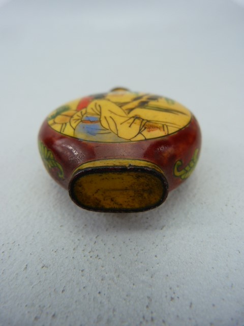 Unusual oriental snuff bottle of enamel over metal. The circular bodied bottle with two enamelled - Image 3 of 4