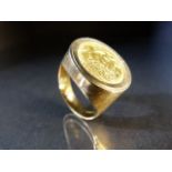 Updated description - Half sovereign 1906 mounted on a chunky 9ct band. Approx weight - 13.5g