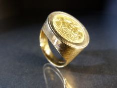 Updated description - Half sovereign 1906 mounted on a chunky 9ct band. Approx weight - 13.5g