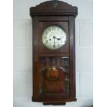 Oak cased American style wall clock key in office