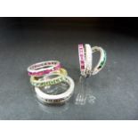 Set of four rings set with coloured stones (A/F)