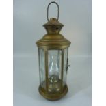 Antique glass decanter along with a brass lantern with cut glass panels